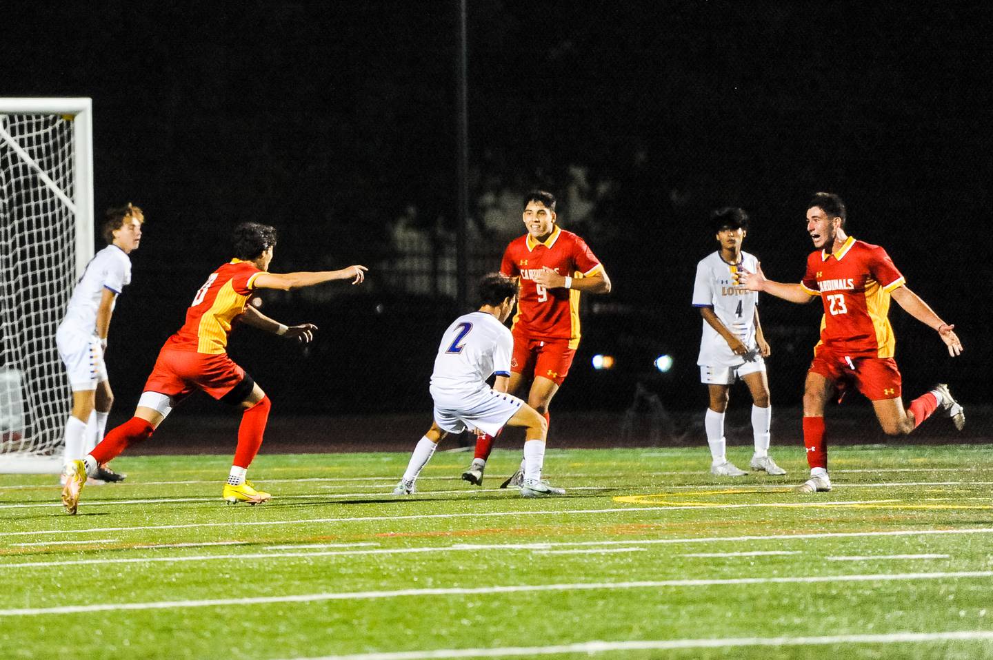 Calvert Hall’s Tyler Flynn (left) reacts with teammates Ryan Belal (9) and Michael Porter (23) after Flynn’s overtime goal gave the Cardinals a 1-0 win over Loyola Blakefield on Wednesday.