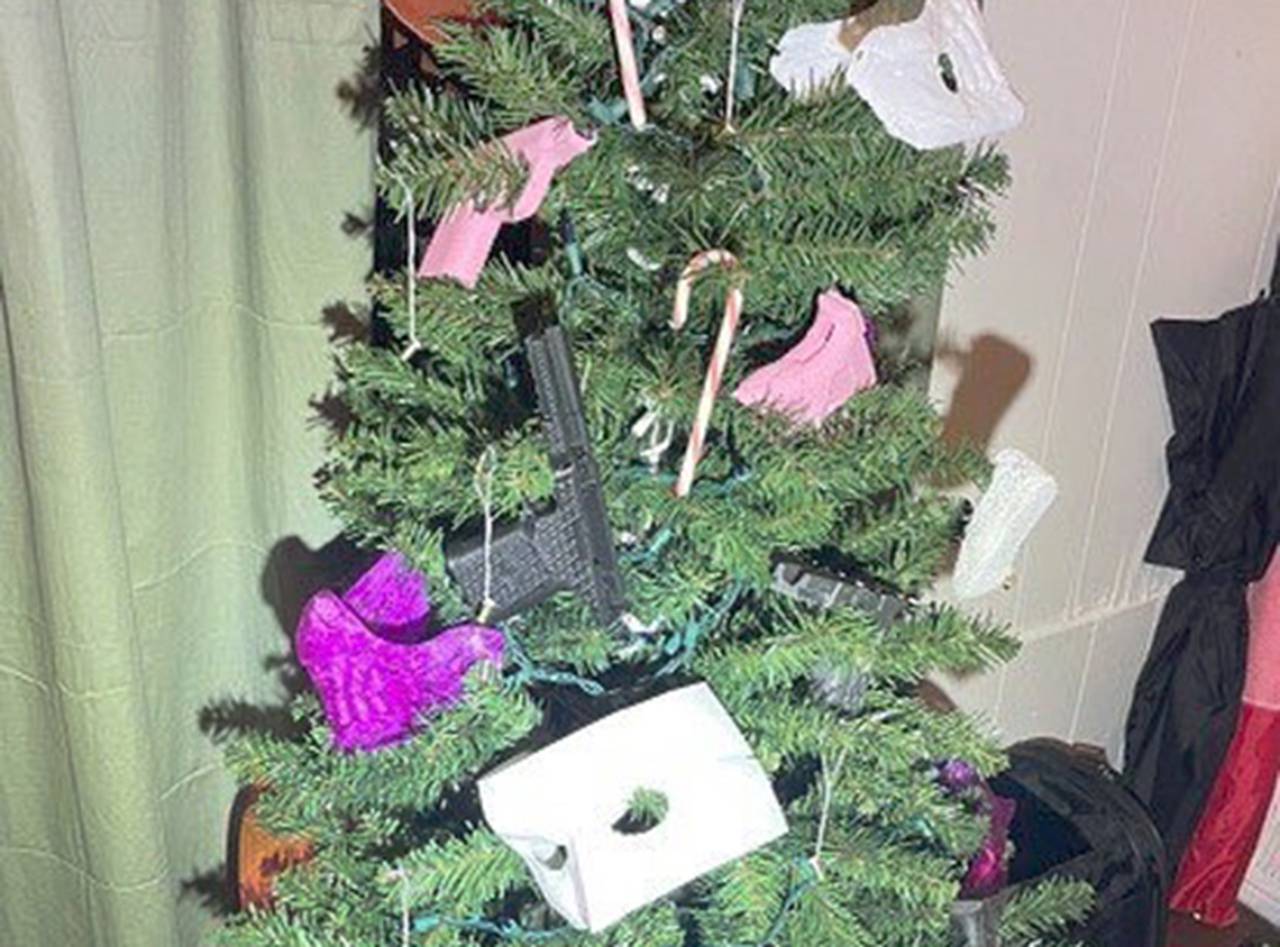 Authorities say Kevin Wallace was 3D printing guns en masse at a rowhome on the city's east side. When a SWAT team raided the home in December 2022, they found a Christmas tree with unfinished handguns hung as ornaments.