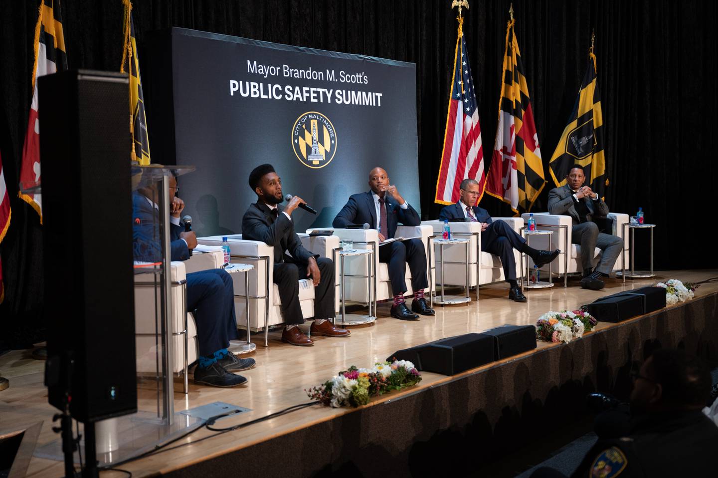 From left to right. Dr. Jason Johnson, Mayor Brandon Scott, Gov. Wes Moore, Attorney General Anthony Brown and Baltimore City State's Attorney Ivan Bates speak on a panel at Morgan State University’s Student Center Theater on February 3, 2023.