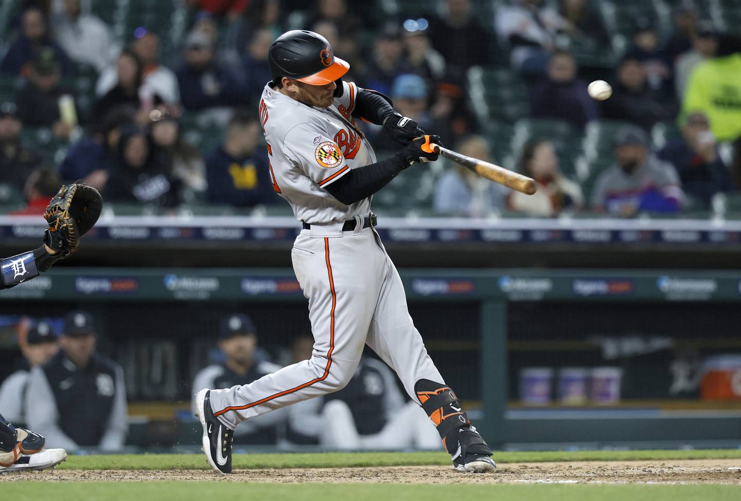 DETROIT, MI -  APRIL 27:  Joey Ortiz #65 of the Baltimore Orioles hits a sacrifice fly ball to drive in one run against the Detroit Tigers during the seventh inning at Comerica Park on April 27, 2023, in Detroit, Michigan.