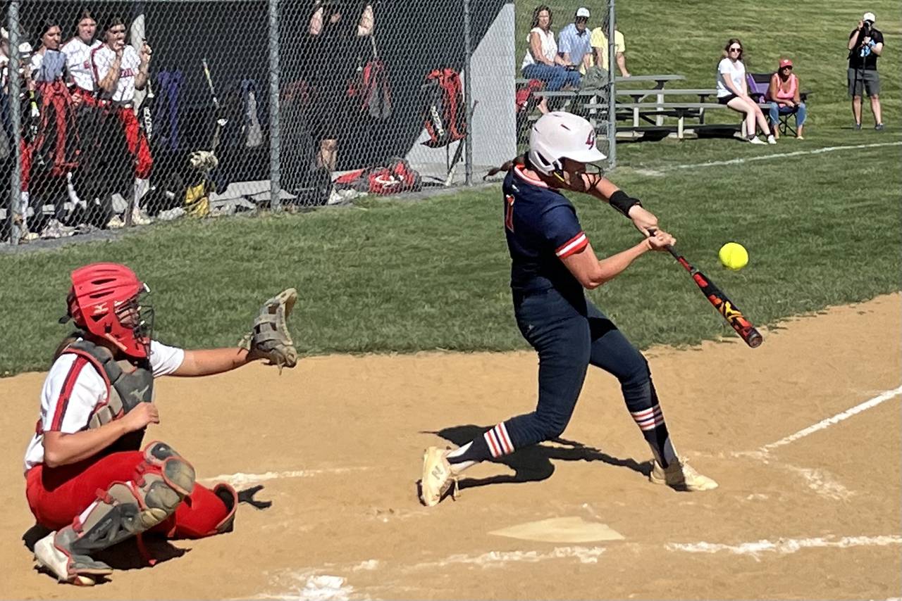 Reservoir's Courtney Johnson connects for a triple during Thursday's Howard County softball contest against Glenelg.