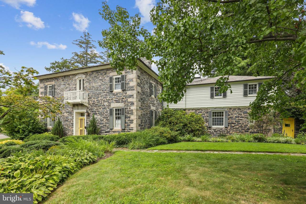 Stone home on spacious, lush grounds in Kernewood of Baltimore.