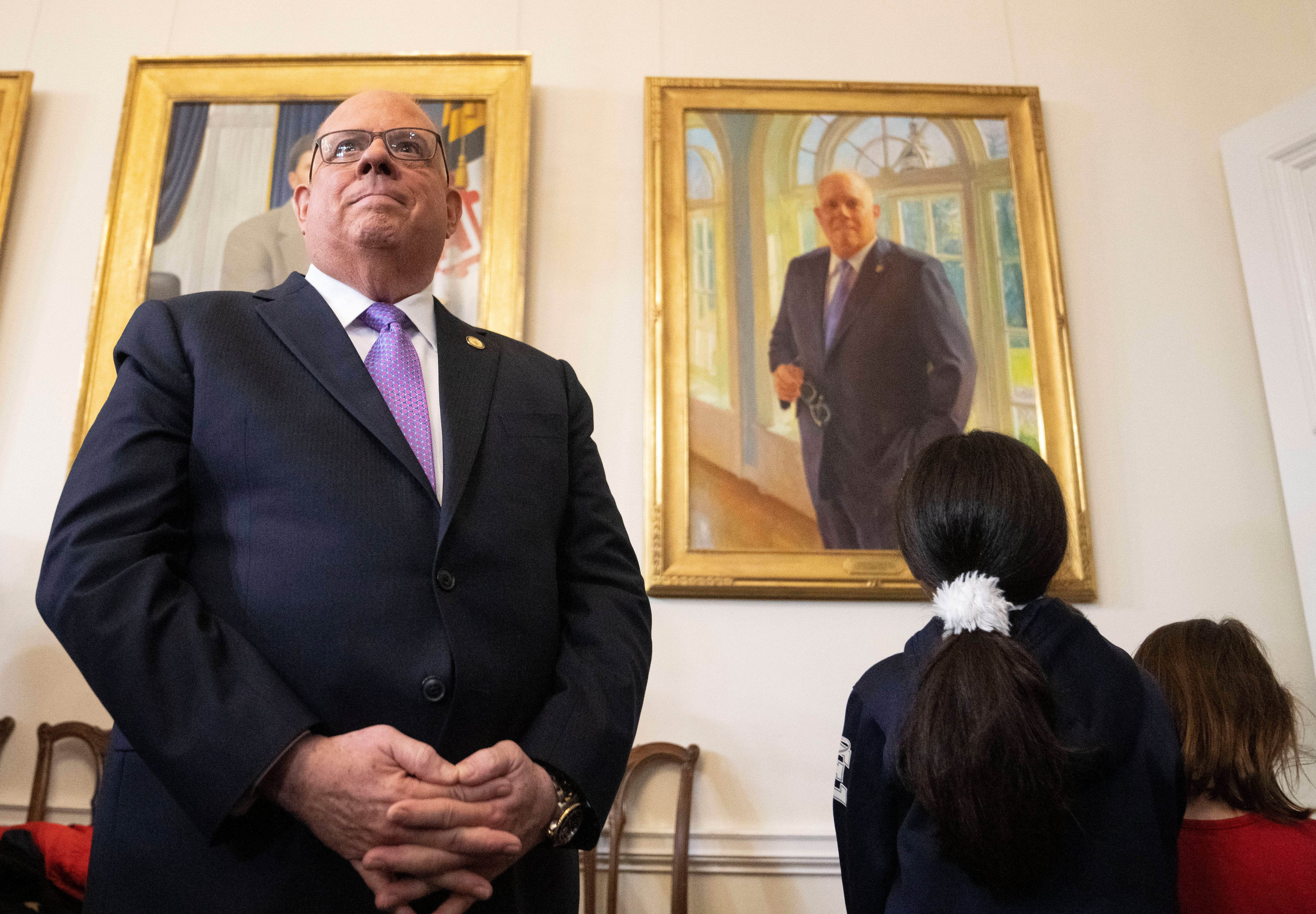 Maryland Gov. Larry Hogan after pulling down a cloth to reveal his portrait during the the hanging of his official portrait in the Governor's Reception Room, in Annapolis, Tuesday, January 10, 2023.