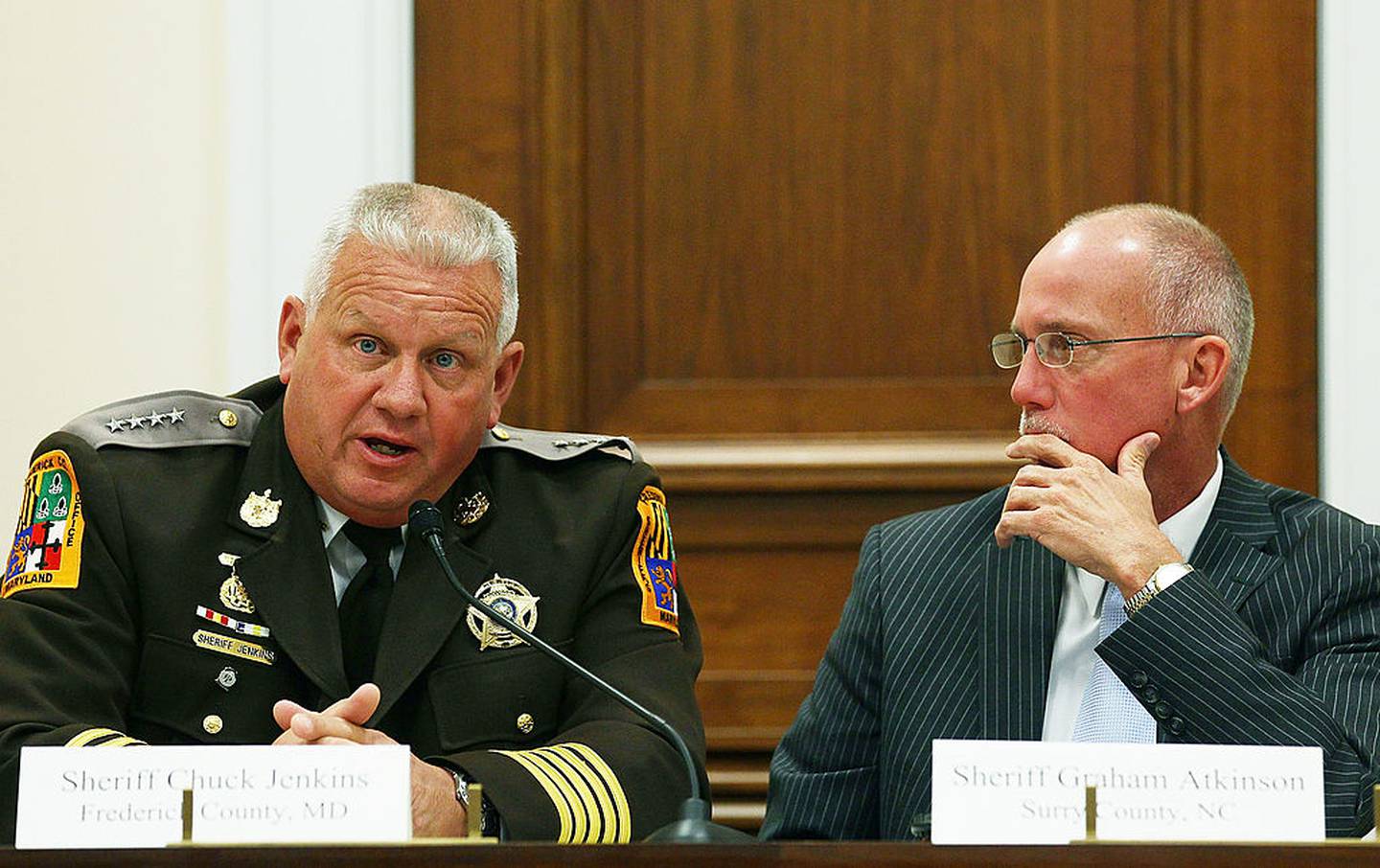 WASHINGTON, DC - OCTOBER 12: Sheriff Chuck Jenkins (L), of Frederick County, MD., and Sheriff Graham Atkinson (R), of Surry County, NC., participate in a discussion on immigration October 12, 2011 in Washington, DC. The Center for Immigration Studies and the House Immigration Reform Caucus hosted the discussion with law enforcement agencies from local municipalities dealing with crime problems that are direct result from failure to control the border, and from lax enforcement of immigration laws.