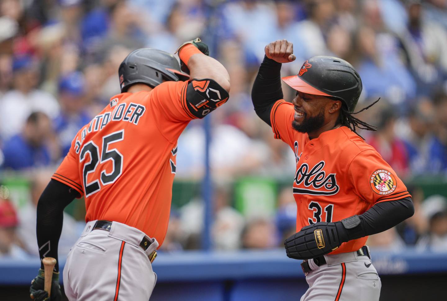 TORONTO, ON - MAY 20: Cedric Mullins #31 of the Baltimore Orioles celebrates his home run with Anthony Santander #25 against the Baltimore Orioles in the third inning during their MLB game at the Rogers Centre on May 20, 2023 in Toronto, Ontario, Canada.
