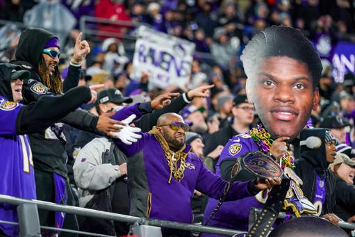 Fans dance with a cutout of Lamar Jackson during the AFC Championship game against the Kansas City Chiefs at M&T Bank Stadium on Sunday, Jan. 28, 2024.