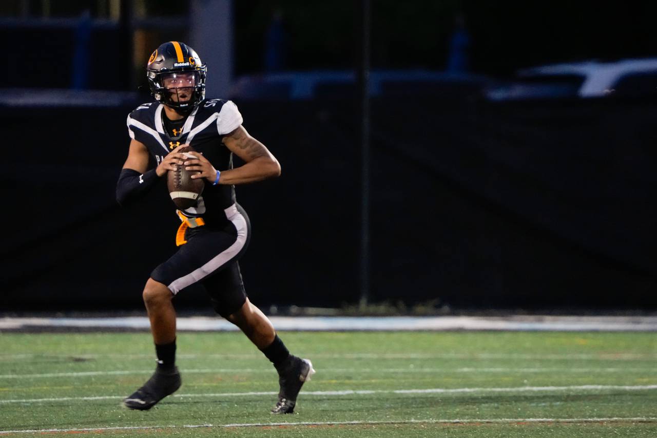 St. Frances quarterback Michael Van Buren runs with the ball during the game against Mater Dei at Homewood Field in Baltimore, Md. on Friday, Sept. 22, 2023.