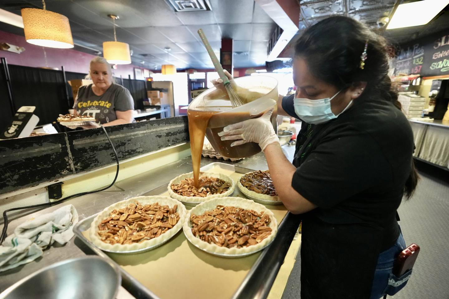 Alejandra Lopez makes pie at Dangerously Delicious on Pi Day on March 14, 2023. (Kaitlin Newman / The Baltimore Banner)