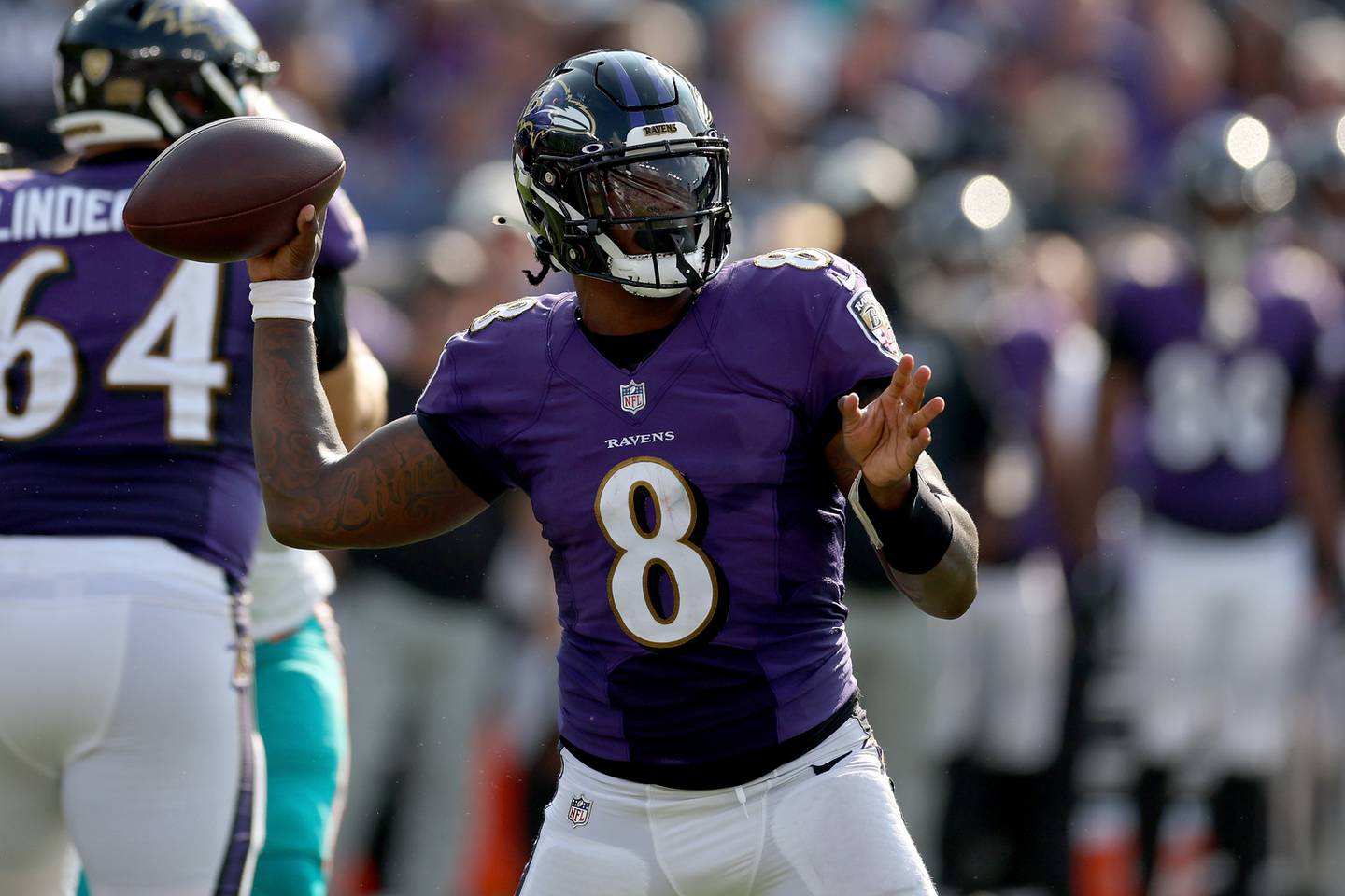 Lamar Jackson of the Baltimore Ravens throws a pass in the fourth quarter against the Miami Dolphins at M&T Bank Stadium.