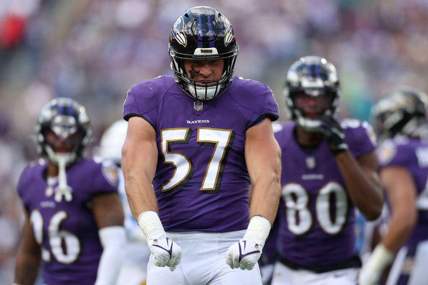 BALTIMORE, MARYLAND - OCTOBER 17: Kristian Welch #57 of the Baltimore Ravens reacts after a tackle during the first quarter against the Los Angeles Chargers at M&T Bank Stadium on October 17, 2021 in Baltimore, Maryland.