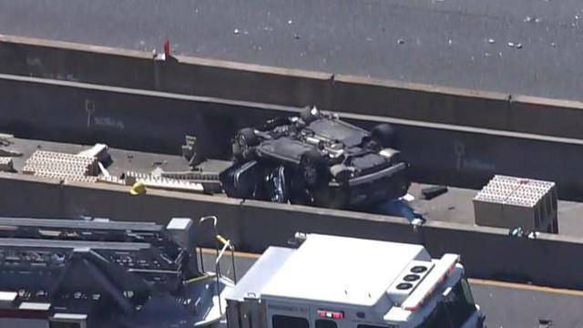 A vehicle sits overturned in a construction zone on the Baltimore Beltway on March 22, 2023. Six construction workers were killed in the crash.