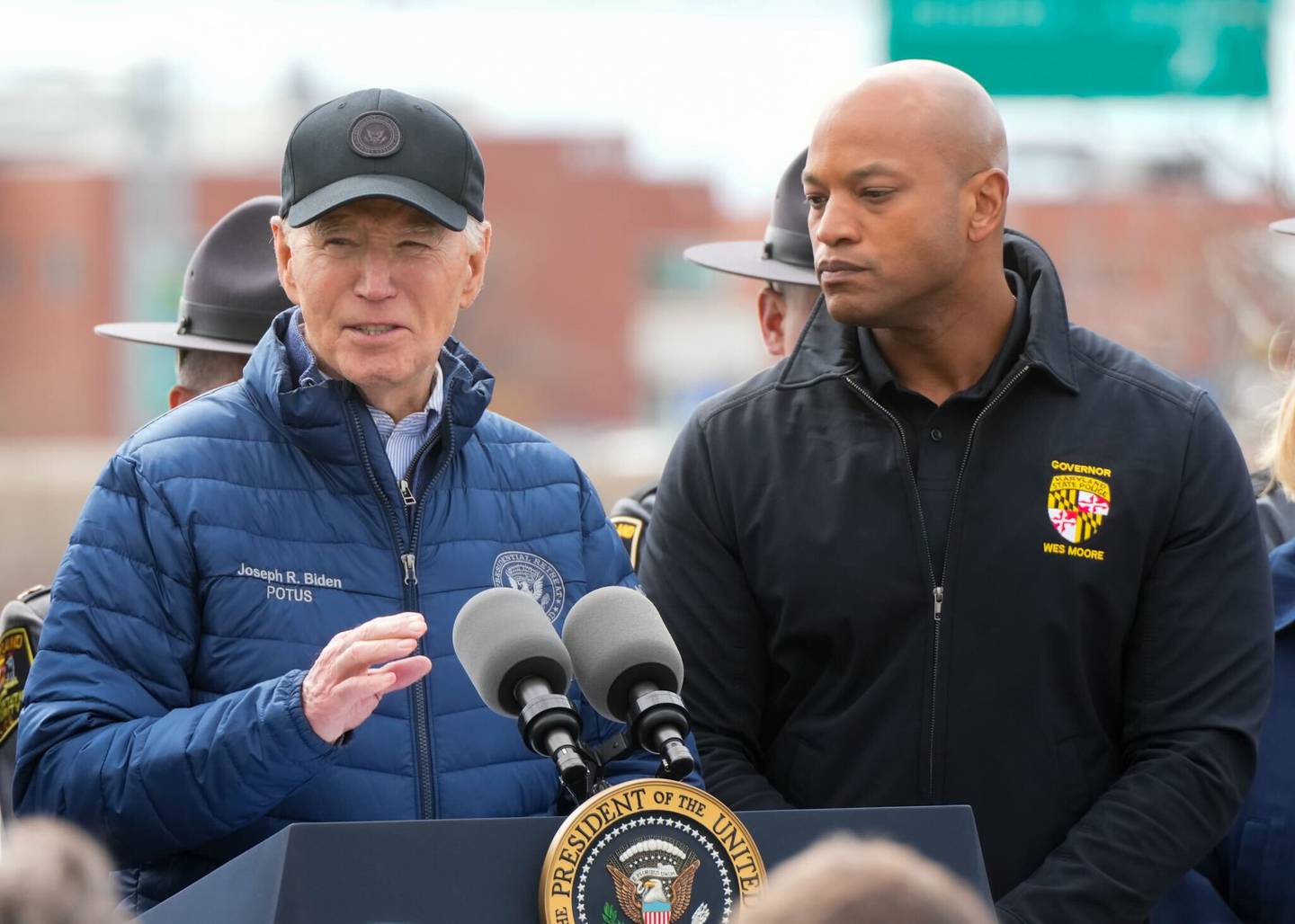 President Joe Biden, accompanied by Maryland Gov. Wes Moore, speaks near the site of the collapsed Key Bridge. Biden, on Friday, April 5, 2024, said " we will not rest ... until the cement has dried on the entirety of a new bridge, a new bridge."