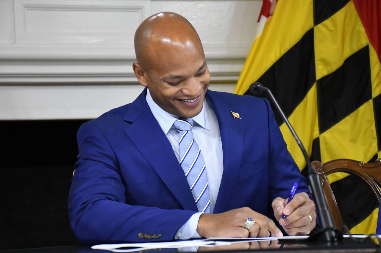 Maryland Gov. Wes Moore signs his first executive orders in the State House on Thursday, Jan. 19, 2023.