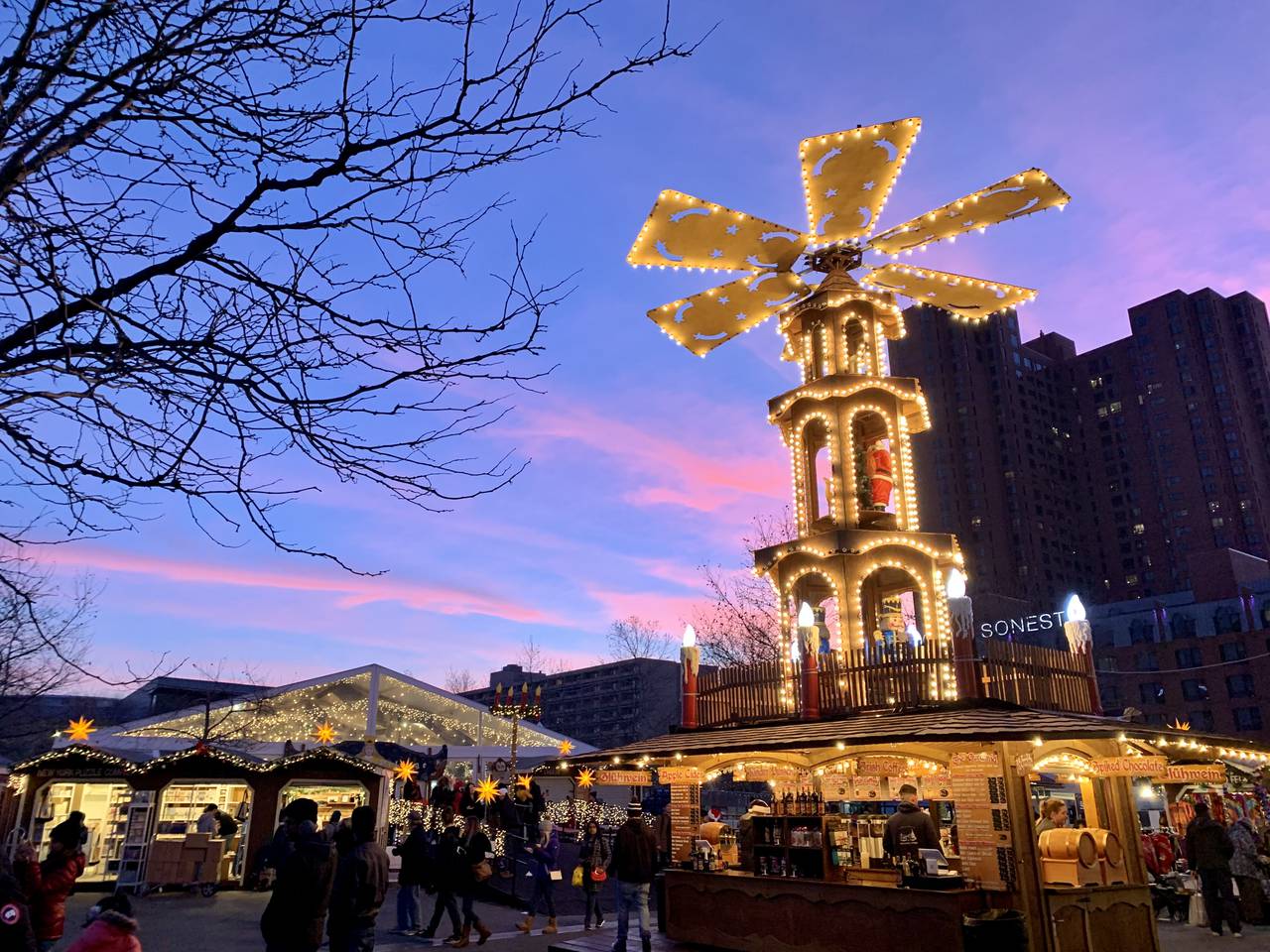 A 30-foot tall traditional Christmas pyramid in the center of a German-style Christmas market.