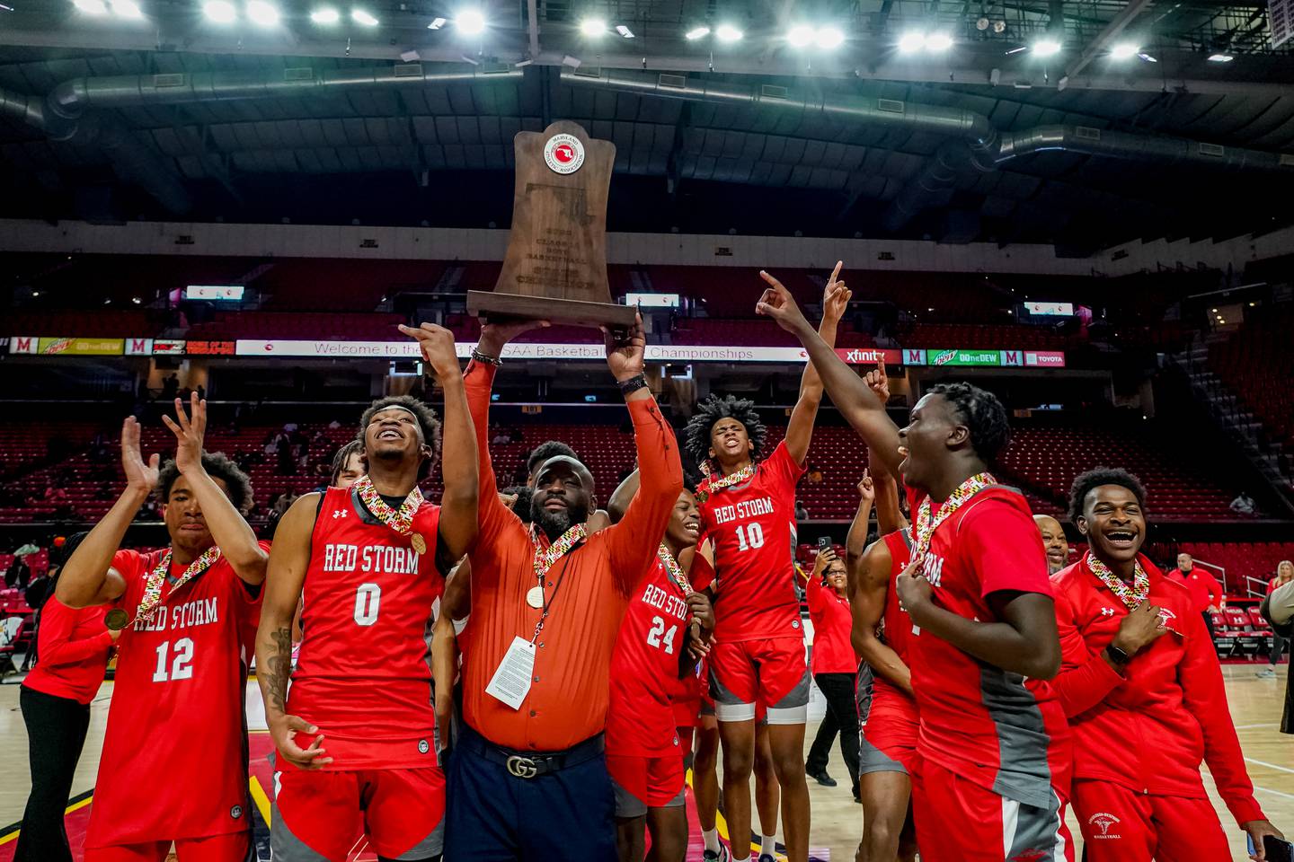 Edmondson-Westside celebrates winning the MPSSAA High School 1A Basketball Championship between Lake Clifton and Edmondson/Westside at Xfinity Center on the University of Maryland campus in College Park.