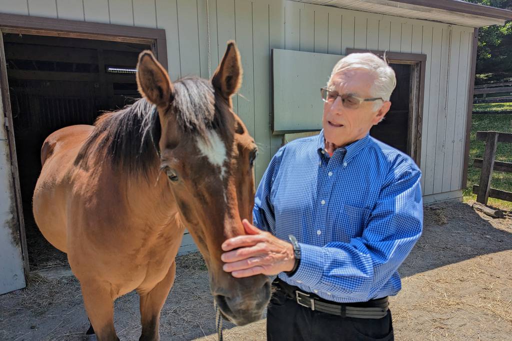 Former Maryland health secretary Martin Wasserman and his horse, T.  Wasserman will swim across the Chesapeake Bay Sunday for the 25th time.