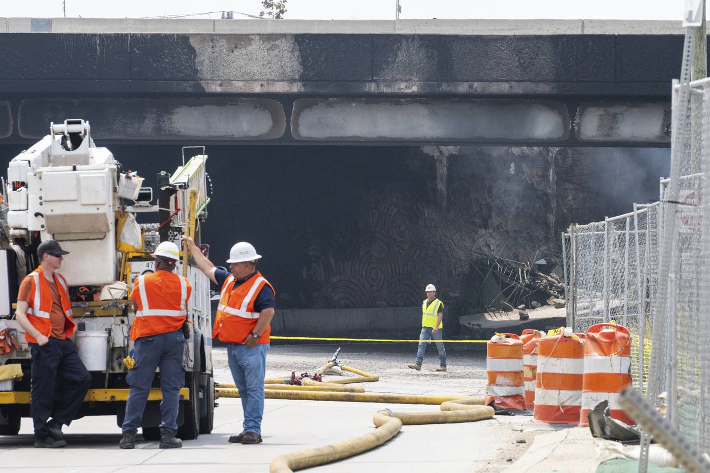 Officials work on the scene following a collapse on I-95 after a truck fire, Sunday, June 11, 2023 in Philadelphia.