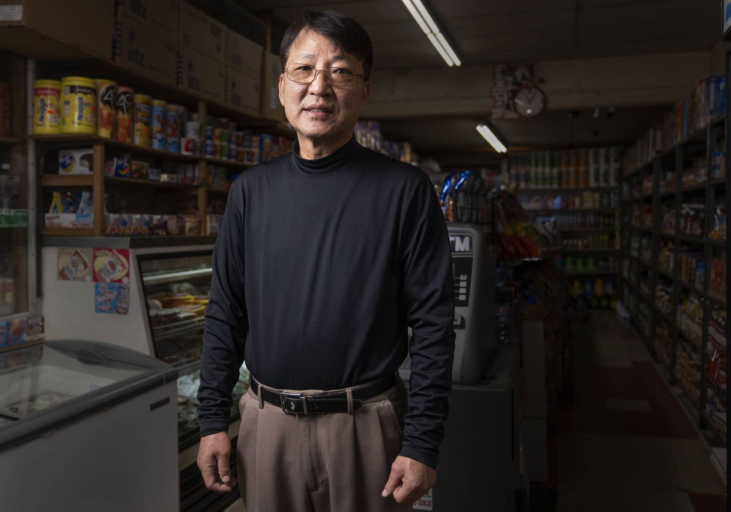 Kevin Lee poses for a portrait at Lee's Mini Market, in Baltimore, Thursday, December 1, 2022.