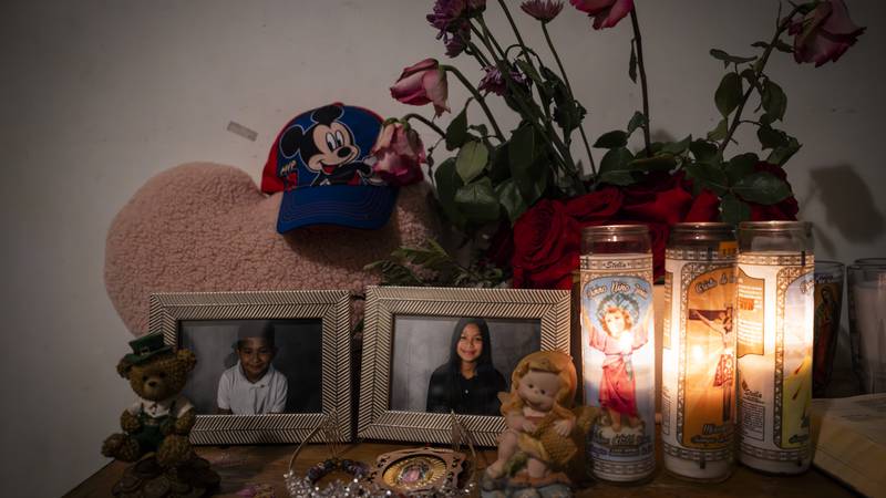 An altar is set up with photos of Angel Gustavo Adolfo Paz Gutierrez, 8, Yeymi Rubi Gutierrez Paz, 13, and their cousin Jeremías Gutierrez Gomez, 22. They all died in a house fire in the early morning of Feb. 27.