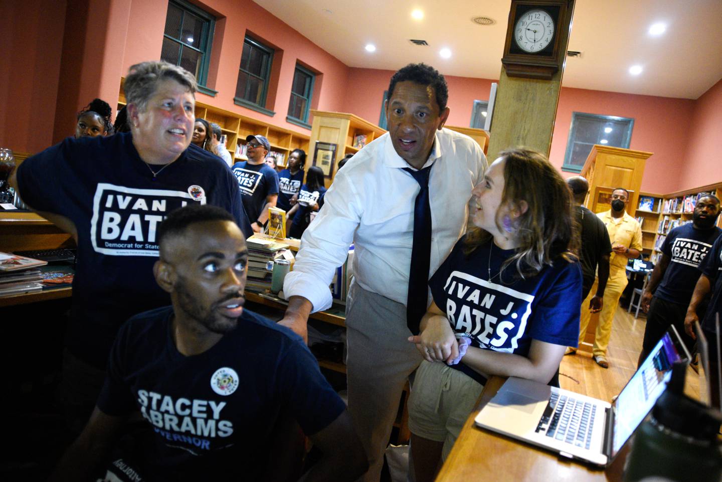 Baltimore City State's Attorney candidate Ivan Bates (center) watches results come in with Rachel Rice (left), Marvin James and Adelaide Sudbrink at Bates' election night event Tuesday night. Maryland held its primary election on Tuesday, July 19.