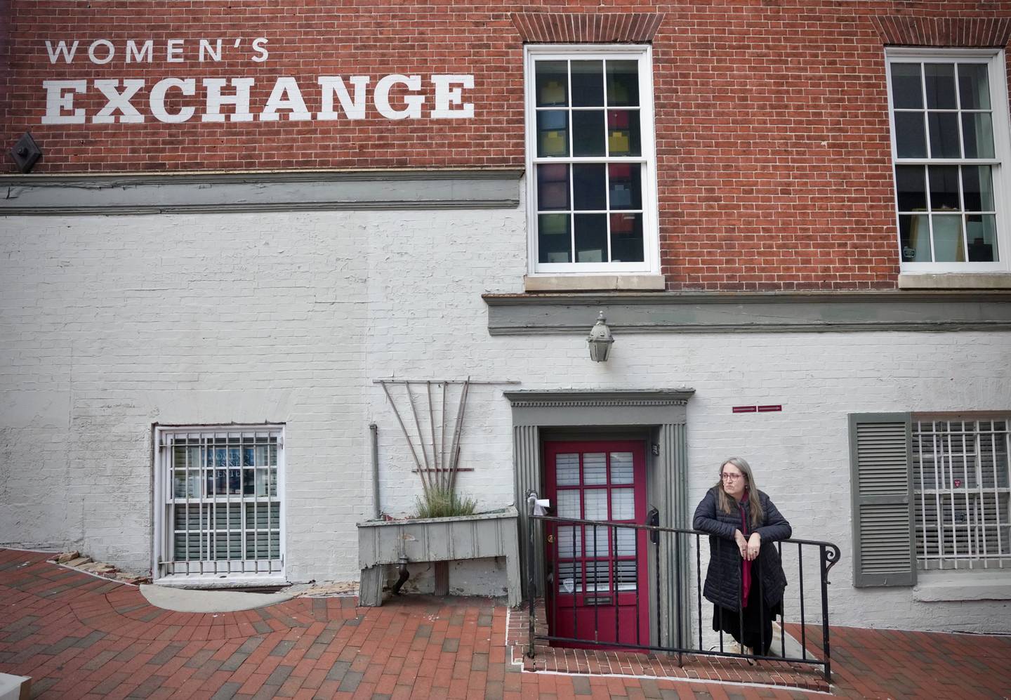 Layne Bosserman, a librarian with Pratt, worked as a waitress for the Women’s Industrial Exchange back in the 1990s. She is volunteering with the MWHC to help with the research and oral history. She is pictured outside the historic building on March 29, 2023.
