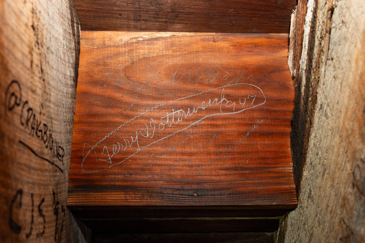 Earlier classes from Mount Saint Joseph High School signed in pencil underneath stairs in the school’s tower, as seen on May 1, 2024.