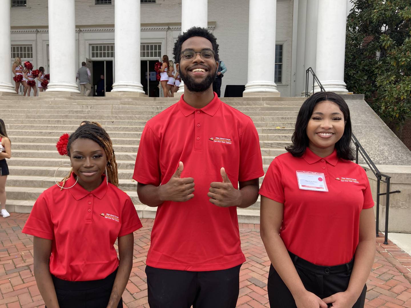 Briana Whitehurst, left; Charles Richardson, Jr.; and Truth Burney are three members of the inaugural class of Maryland Serves, a program that offers a paid year of service. One track of the program focuses on young adults, while the other track accepts participants of all ages. Gov. Wes Moore held a launch ceremony for the program at the University of Maryland, College Park on Friday, Oct. 27, 2023.
