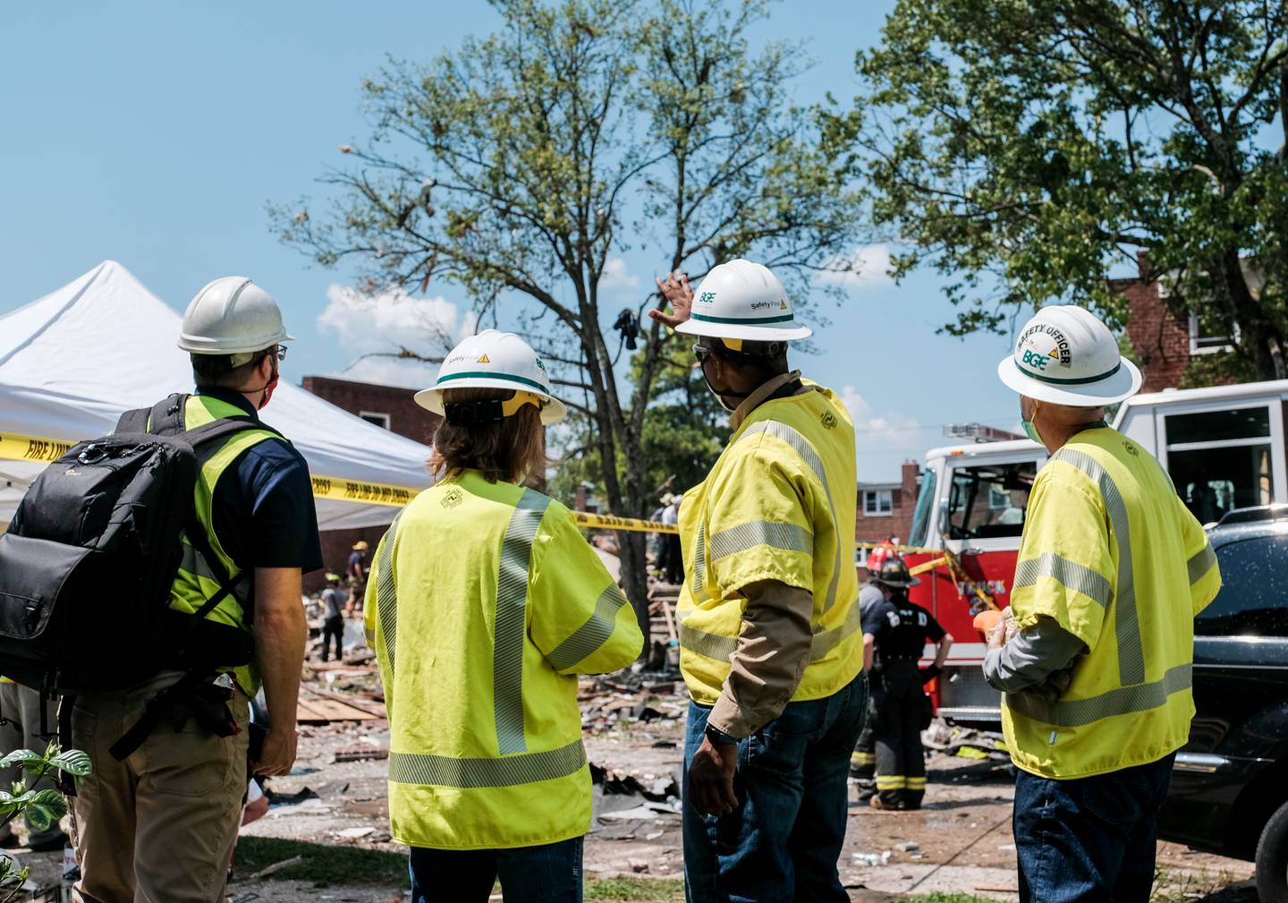 Baltimore Gas and Electric employees work at the scene of an explosion on August 10, 2020 in Baltimore.