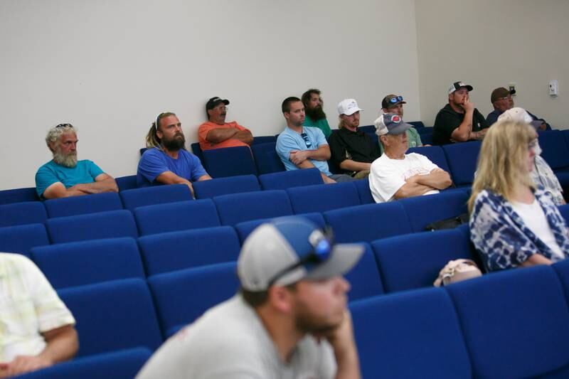 A frustrated crowd listens to VMRC staff present potential management measures to the The Crab Management Advisory Committee (CMAC) at the VMRC Main Office in Fort Monroe, Va., on Wednesday, June 8, 2022.