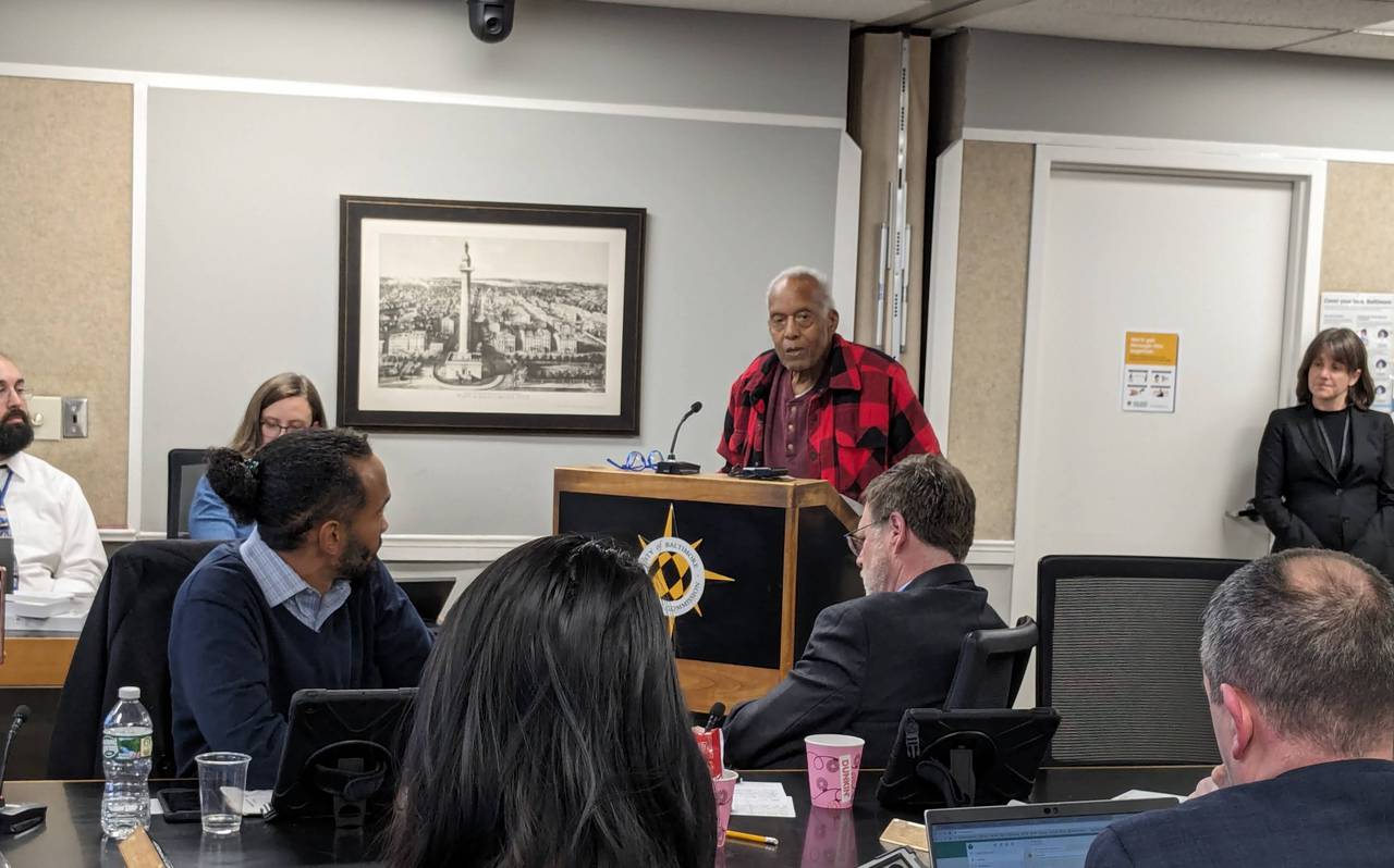 This is a photo of retired architect Leon Bridges speaking to the Baltimore Planning Commission about the proposed redevelopment of Harborplace.