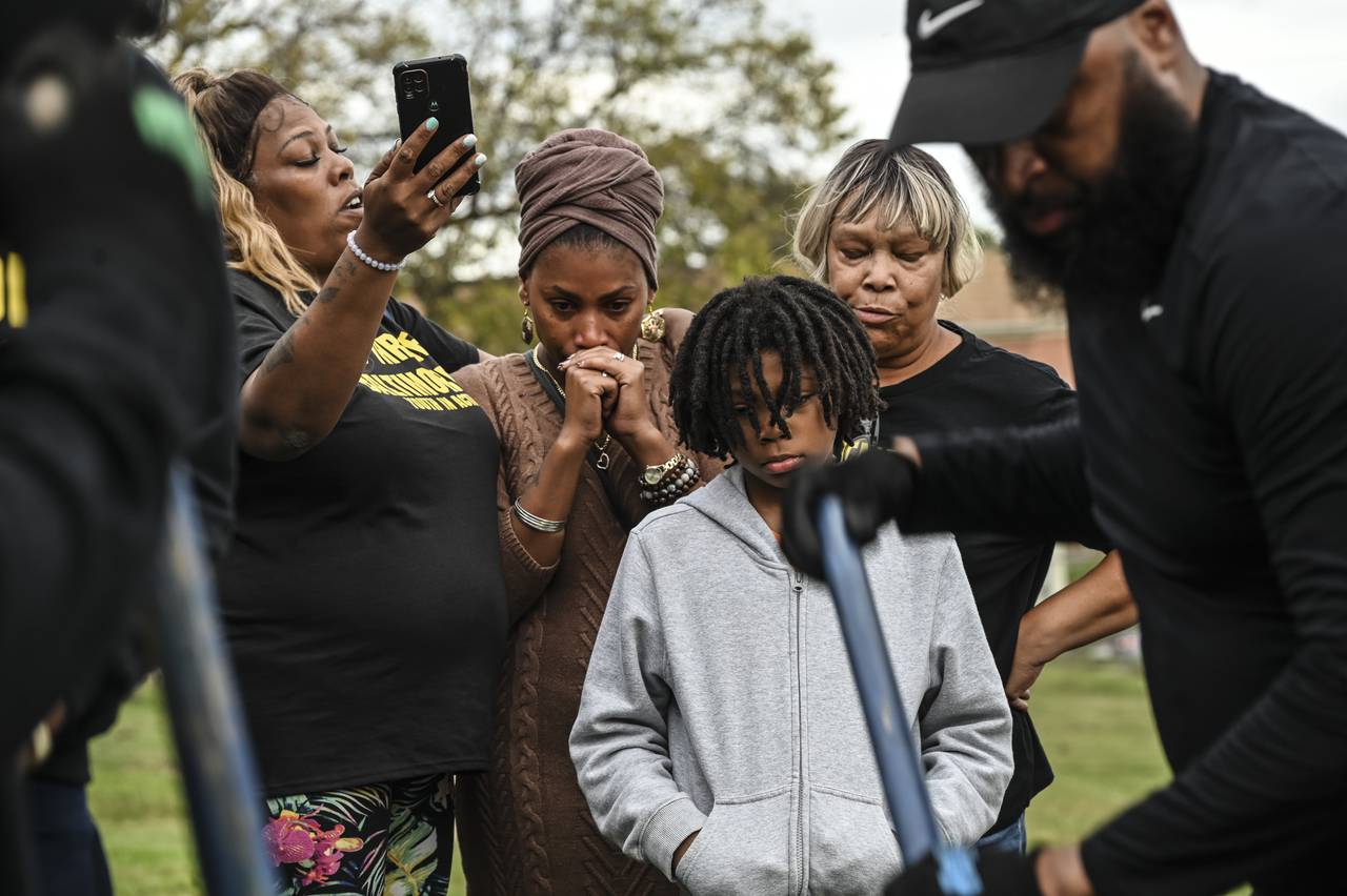 Crystal Gonzalez, mother of Aaliyah Gonzalez, 18, who was killed in the Brroklyn Homes shooting in July, watchs a tree being planted in her memory at the Healing Day event in Brooklyn on Saturday