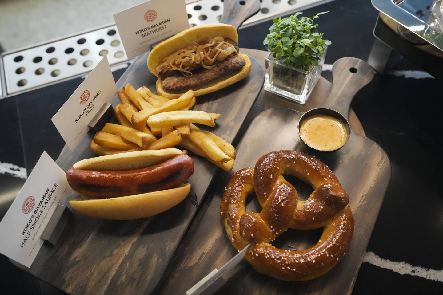 The new menu items include pretzels with beer cheese, hotdogs and sausages.