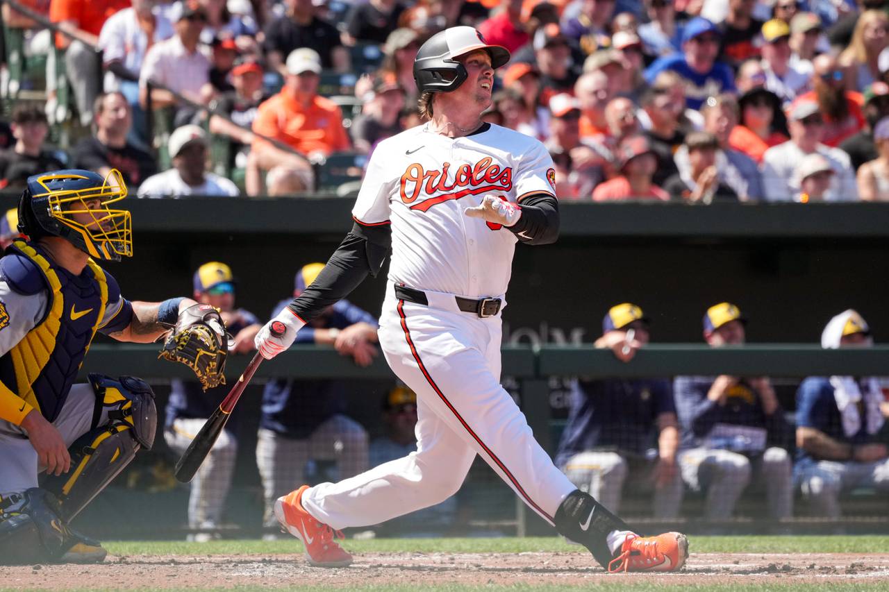 Baltimore Orioles catcher Adley Rutschman (35) connects with a pitch during game three of a series against the Milwaukee Brewers at Camden Yards on April 14, 2024. The Orioles beat the Brewers, 6-4, to avoid getting swept in the series.