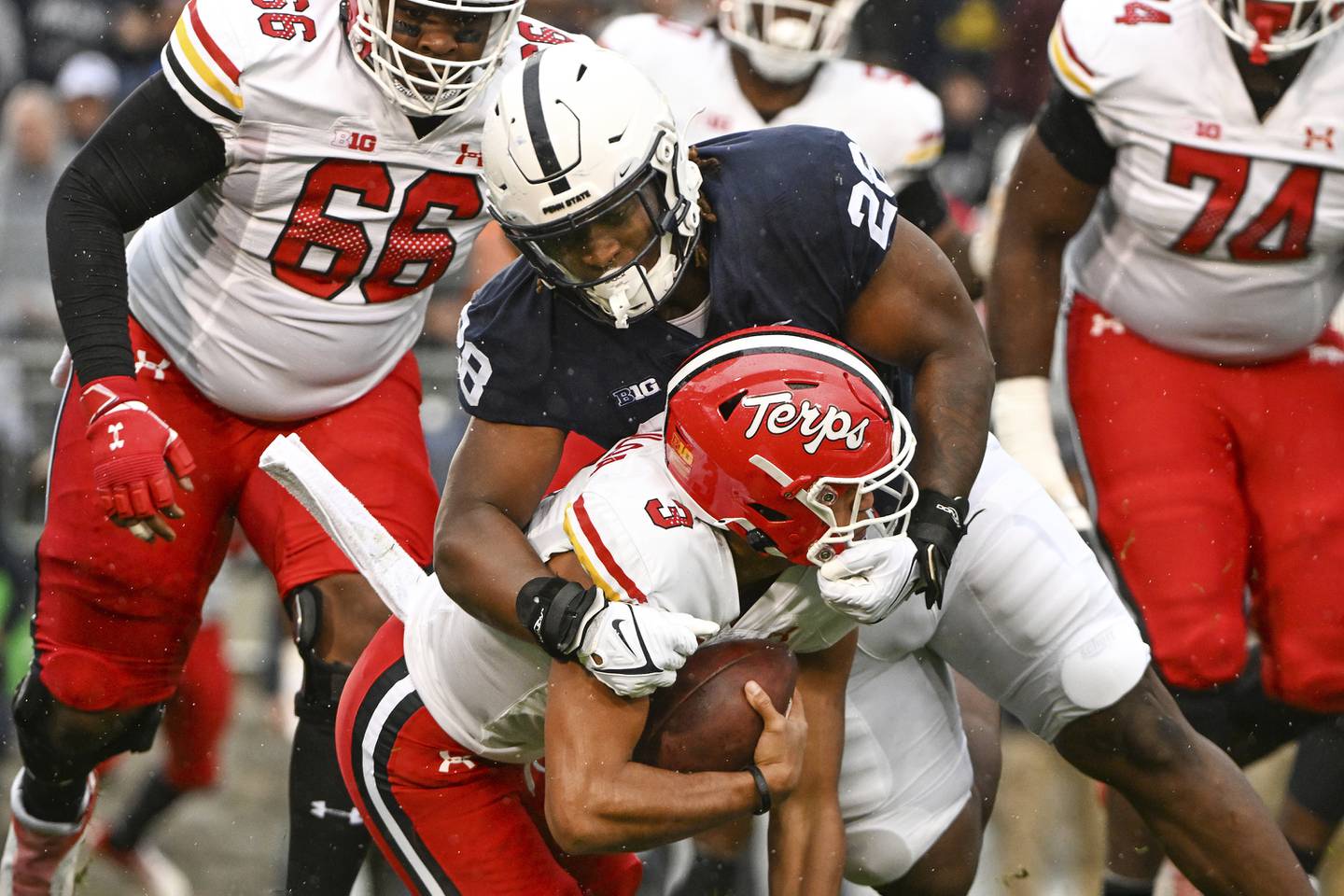 Penn State defensive tackle Zane Durant sacks Maryland quarterback Taulia Tagovailoa (3) during the first half of an NCAA college football game, Saturday, Nov. 12, 2022, in State College, Pa.