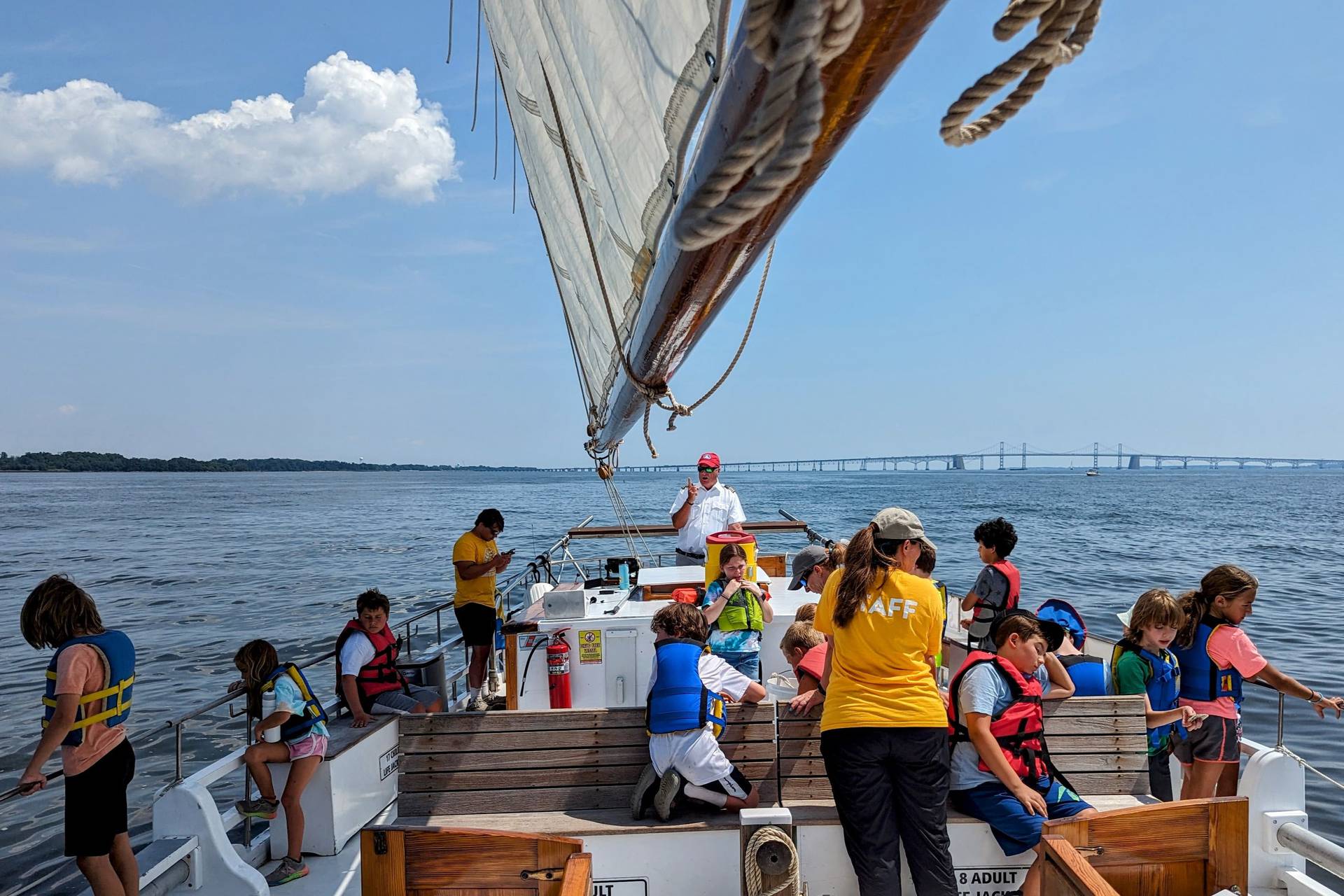 Capt. Rick Flamand talks to summer campers aboard the Wilma Lee, an 80-year-old skipjack, during a morning cruise out of Annapolis.