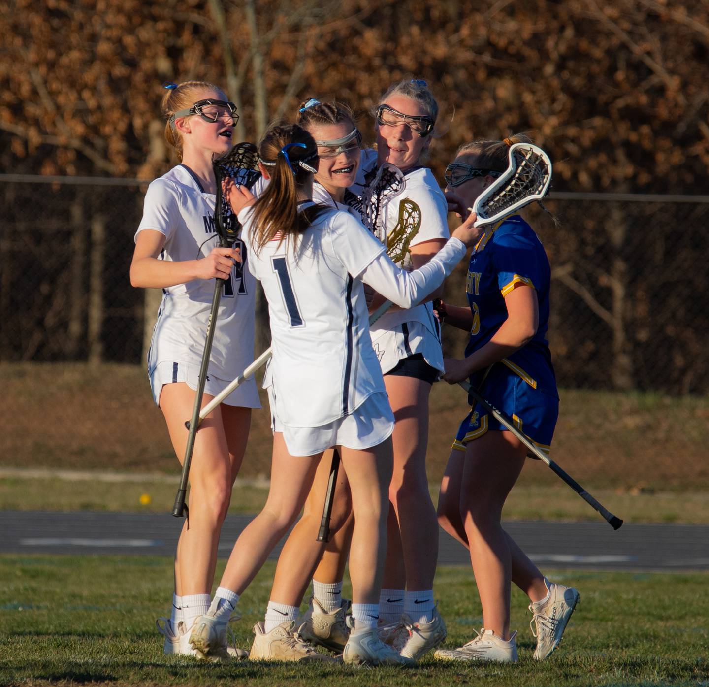 Manchester Valley celebrate after a goal by Haylee Bittinger in Thursday's Carroll County girls lacrosse match. The No. 11 Mavericks scored the game's first 9 goals en route to a 13-6 victory over 13th-ranked Liberty in Manchester.