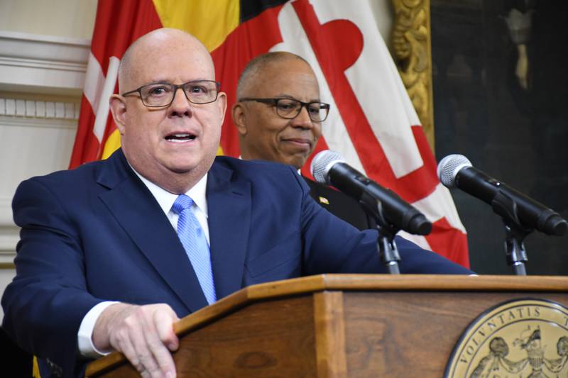 Maryland Gov. Larry Hogan discusses the budget during a press conference at the State House in Annapolis on Thursday, Dec. 15, 2022. He is joined by Lt. Gov. Boyd Rutherford.