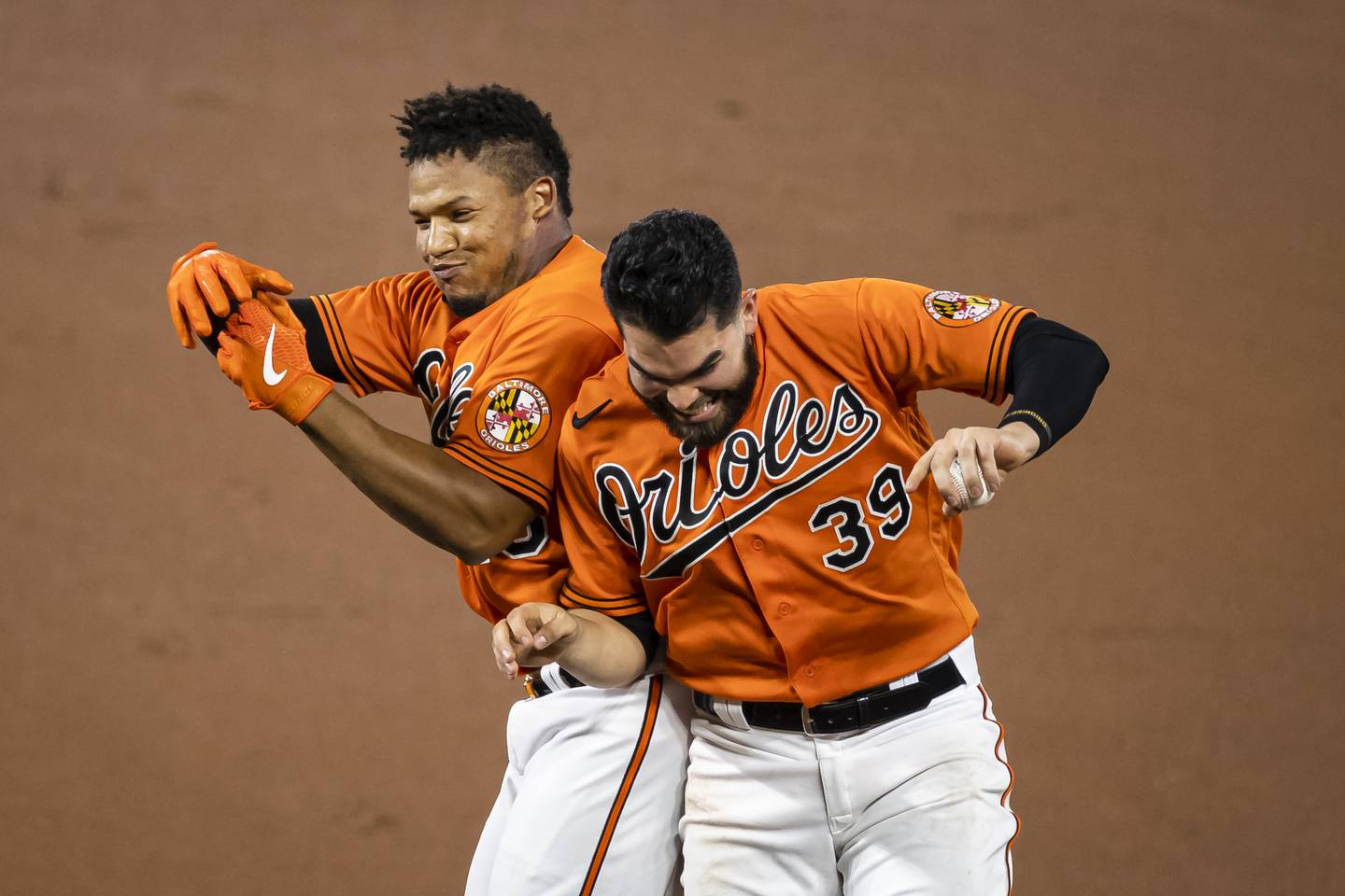 BALTIMORE, MD - AUGUST 22: Pedro Severino #28 of the Baltimore Orioles celebrates with Renato Nunez #39 after hitting in the game-winning run against the Boston Red Sox during the tenth inning at Oriole Park at Camden Yards on August 22, 2020 in Baltimore, Maryland. (Photo by Scott Taetsch/Getty Images)