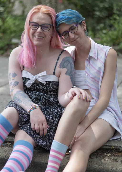 Zascha Isenhardt and Chrys Lichtel celebrate Trans Pride with matching socks at the Baltimore Trans Pride parade on June 3, 2023.