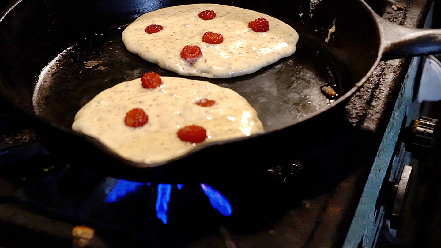 Pancakes make wineberries, a type of raspberry originally imported from Japan as an ornamental plant. The berries are jewel-bright, almost like red currants but with a deeper, red-wine color.  They are very juicy and quite delicious.