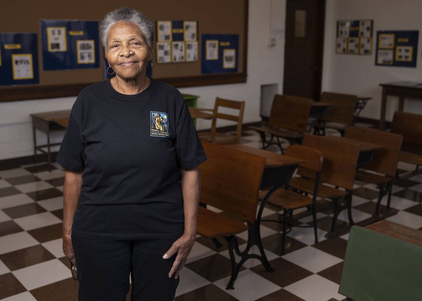 Harriet Tubman Foundation President, Bessie Bordenave, and a 1962 graduate of the Harriet Tubman School, poses for a portrait inside of the Bernice Beaird Recreated Classroom at the Harriet Tubman Cultural Center, Tuesday, February 21, 2023.