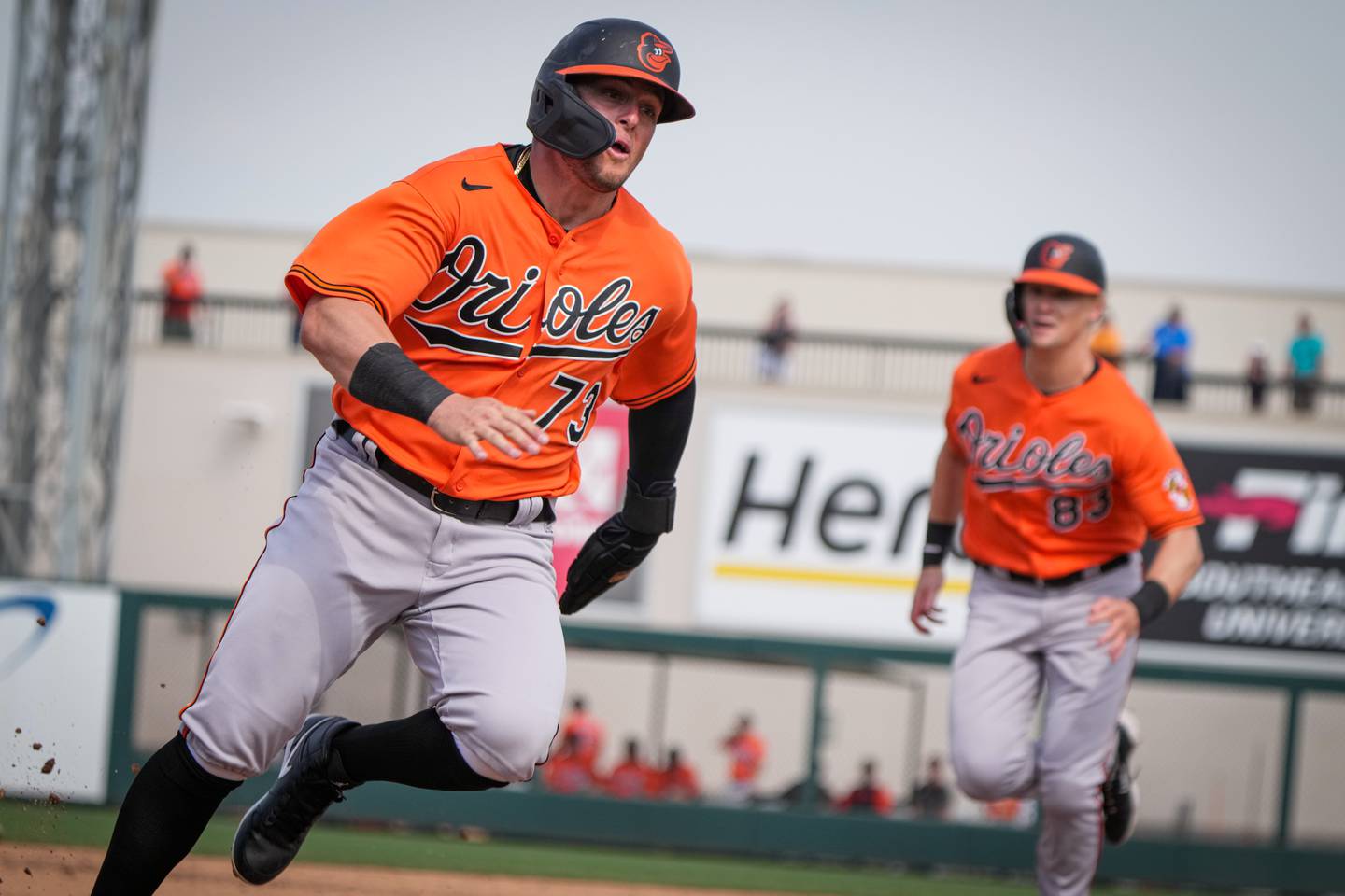 César Prieto (73) runs to home plate, followed by Kyle Stowers (83) behind him, on a double by Ryan O’Hearn in the sixth inning of a game against the Tigers on 3/2/23. The Baltimore Orioles lost to the Detroit Tigers, 10-3, in the Florida Grapefruit League matchup.