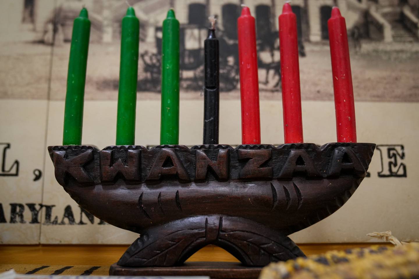 A kinara holds seven candles for Kwanzaa celebrations in a display inside Baltimore's City Hall.