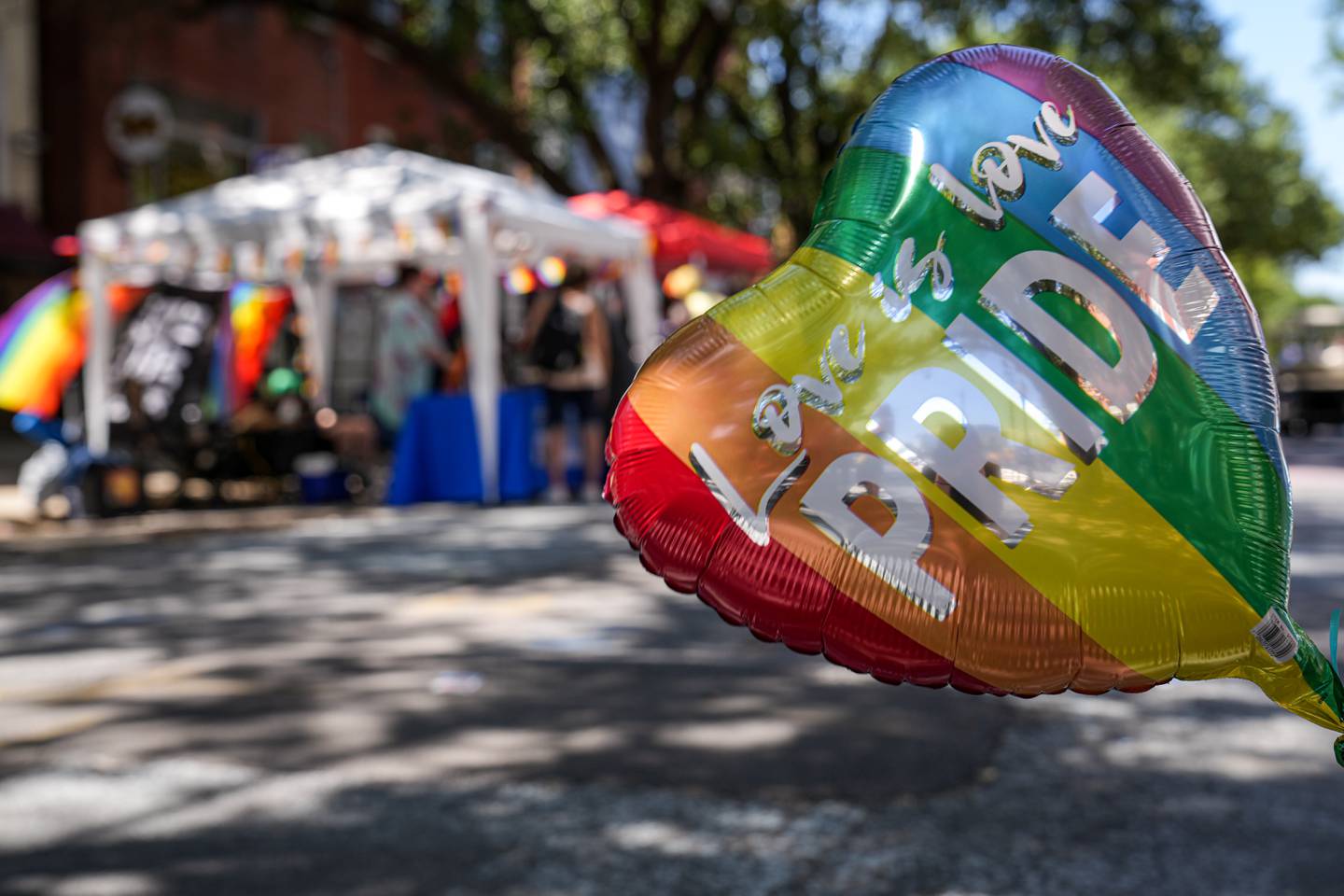 A balloon reading “Love is love, pride” waves in the wind on June 4 at Baltimore Trans Pride 2022.