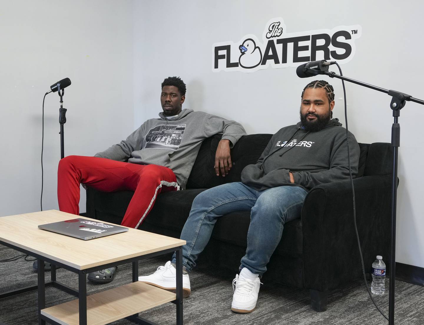 Henry Sims (left), and Devin McCoy (right) set up their versatile event space for a podcast recording session on 1010 Fleet St. in Downtown Baltimore, MD., on March 6, 2023.