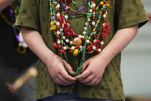 Louisiana beads adorn many patrons at the National Outdoor Show.