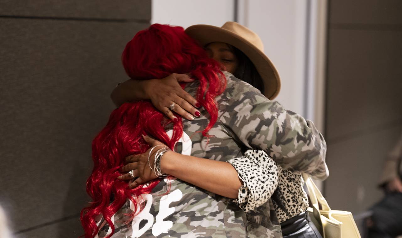 Krystal Gonzalez embraces Tameka Lynbrith at the Bereaved Mother's Fashion Show on November 18, 2023.