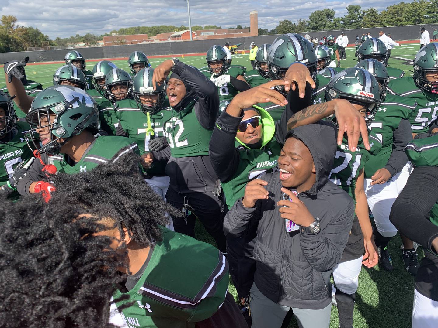 Milford Mill football team celebrates after victory over New Town Oct. 8.