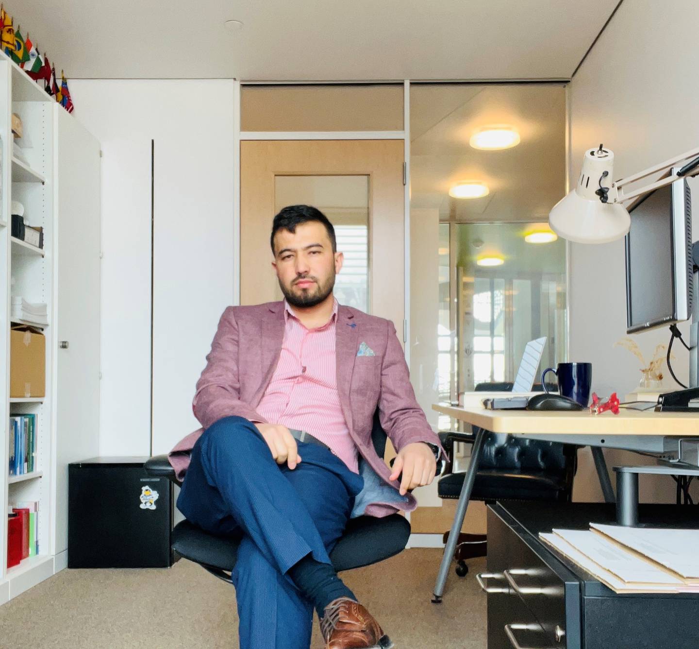 Sayed Wakil Musleh, an Afghan lawyer and refugee who now lives in Baltimore, sits in his office at the University of Baltimore School of Law.
