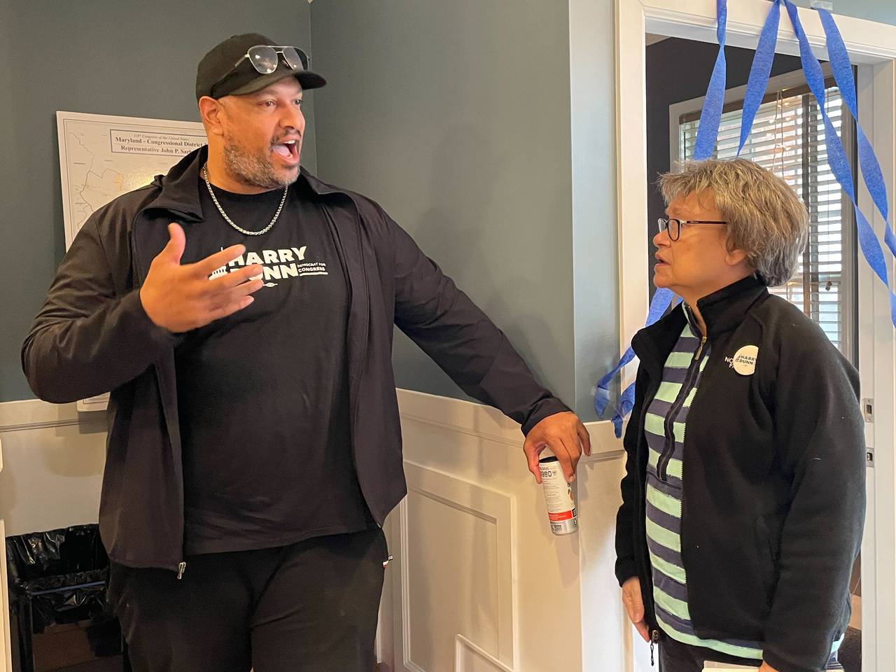 Ex-Capitol cop Harry Dunn speaks with campaign volunteer Cathy Teleky at his Ellicott City campaign headquarters on Saturday, April 27, 2024.